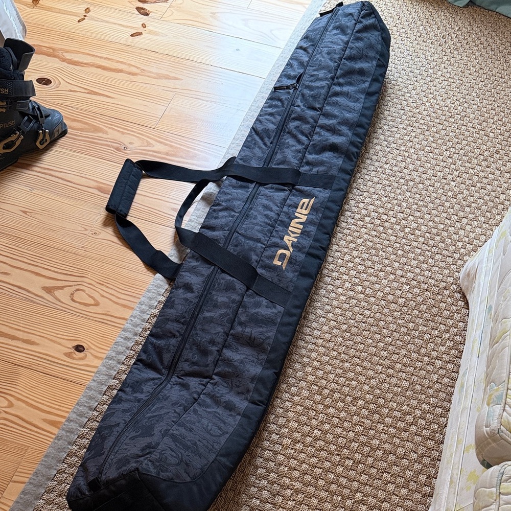 Dakine Black Quilted Ski Sleeve with Gold Logo